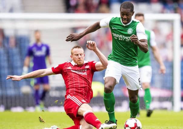 Aberdeen got the better of Hibs in last season's Scottish Cup semi-final. Marvin Bartley is tackled by Adam Rooney. Picture: Bill Murray/SNS