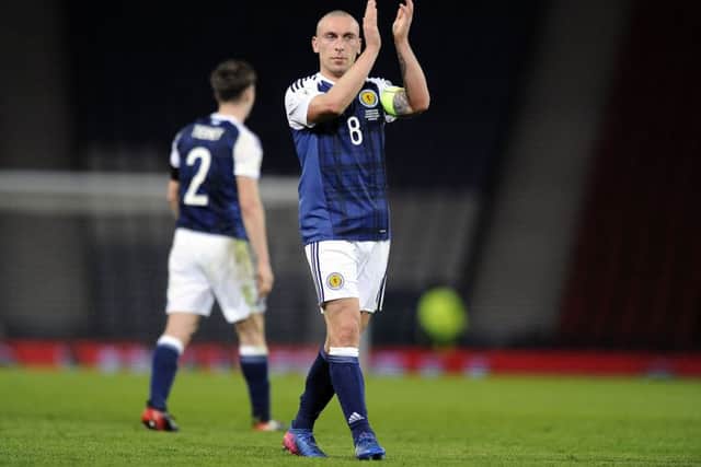 Scott Brown salutes the Scotland fans after the victory over Slovenia in March at Hampden. Picture: Michael Gillen