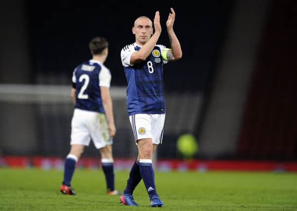Scott Brown salutes the Scotland fans after the victory over Slovenia in March at Hampden. Picture: Michael Gillen