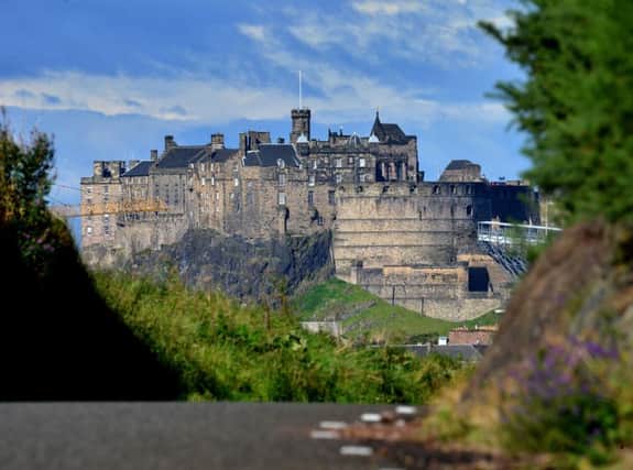 Edinburgh will keep its tourist information office - but many other smaller Scottish towns will lose theirs. Picture: Jon Savage