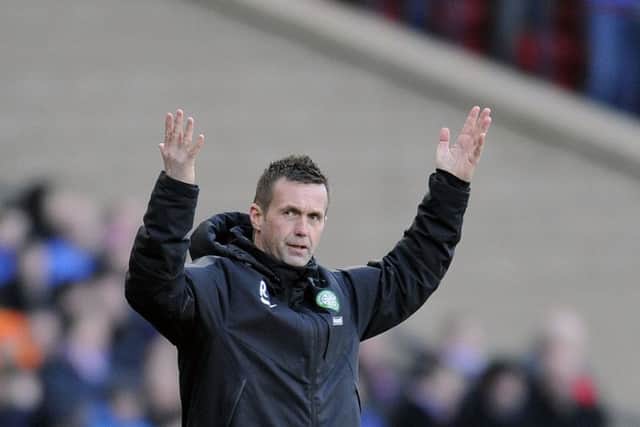 A fully clothed Ronny Deila reacts during a match between Celtic and Rangers at Hampden. Picture: John Devlin
