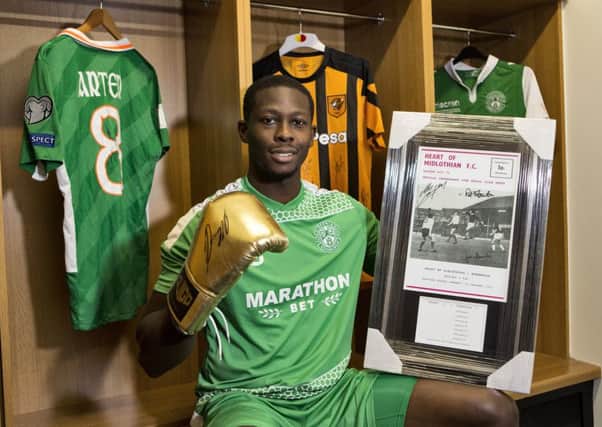 Hibernian's Marvin Bartley is fundraising for the victims of the Grenfell Tower disaster by raffling off sporting memorabilia. Picture: SNS