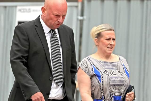 Paul Roberts and his partner Deborah Briton leave court. Picture: PA