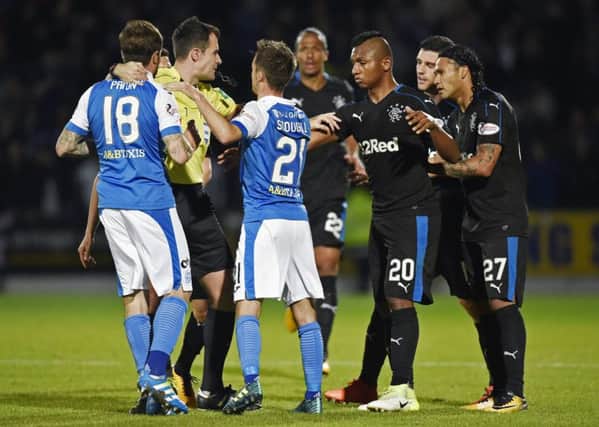 St Johnstone and Rangers players clash after an altercation between Paul Paton (far left) and Graham Dorrans (second right). Picture: SNS