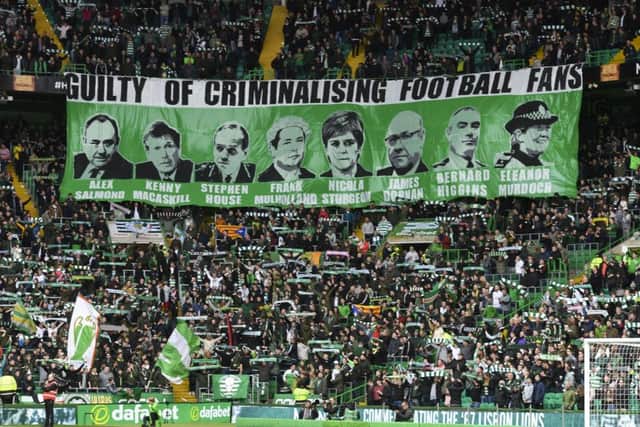 Celtic fans unveil a banner. Picture: SNS