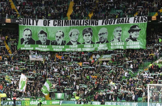 Celtic fans unveil a banner. Picture: SNS