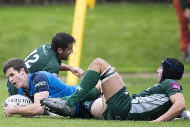 Boroughmuirs stand-off Greg Cannie touches down for a try he then converted.  Photograph: Graham Stuart/SNS