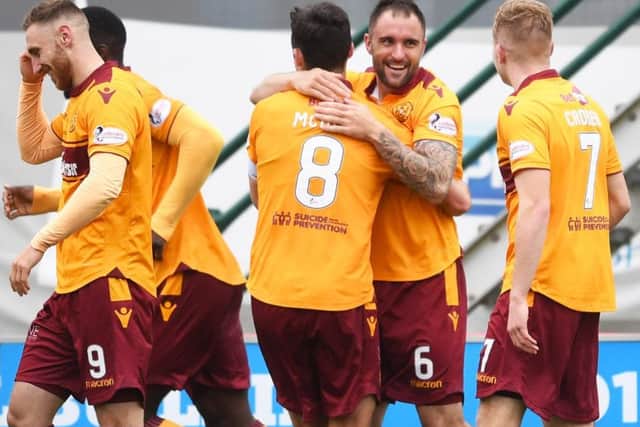 Peter Hartley, right, celebrates after giving Motherwell the lead. Picture: SNS