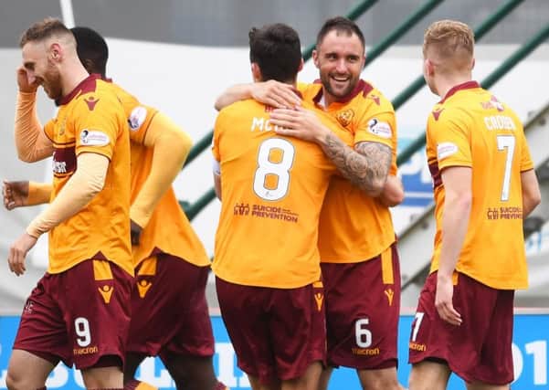Peter Hartley, right, celebrates after giving Motherwell the lead. Picture: SNS