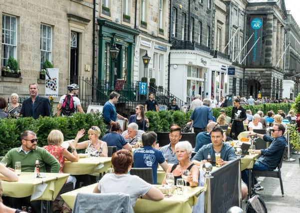 Edinburghs hospitality sector has been boosted by the success of its festivals. Picture: Ian Georgeson