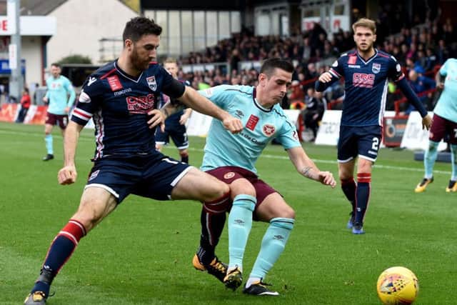 Jamie Walker holds off Ross Drapers challenge during Hearts 2-1 win over Ross County on Saturday. Picture: SNS.