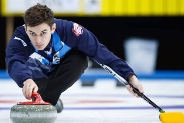 Grant Hardie delivers a stone during Scotland's victory over Canada. Picture: Keystone via AP.