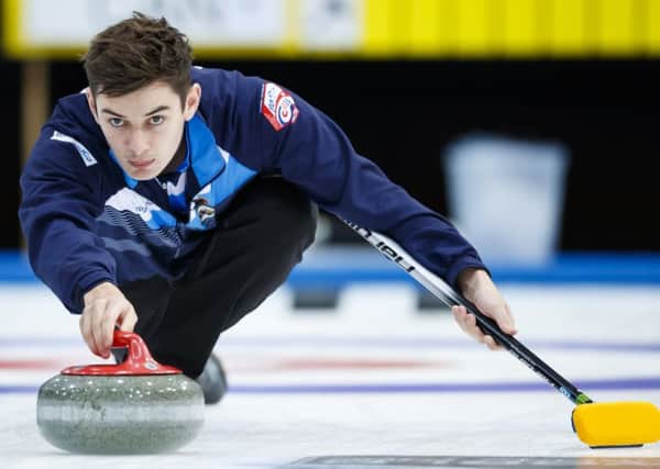 Grant Hardie delivers a stone during Scotland's victory over Canada. Picture: Keystone via AP.