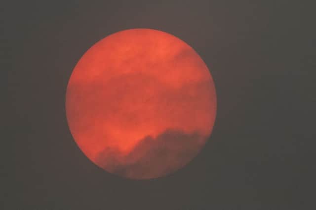 Neil Pugh of a red sun spotted in the sky over Bromsgrove in Worcestershire, which was caused by Storm Ophelia. Picture: Neil Pugh/PA