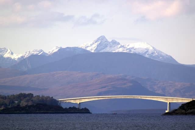Skye bridge with snow covered Cuillins in the background
in 2000. PIC: AlanMilligan/TSPL.