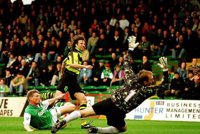 Jorge Cadete scores for Celtic in a 3-1 win over Hibs at Easter Road, despite the best efforts of Darren Dods and Jim Leighton. Picture: TSPL