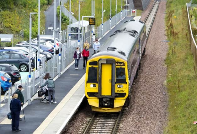Passengers board an Edinburgh-bound train at the reopened Newtongrange station in Midlothian in 2016, part of the new Borders Railway. Picture: Ian Rutherford/TSPL
