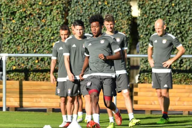 David Alaba leads the Bayern squad through their paces at the Saebener Strasse training ground this morning. Picture: Getty Images
