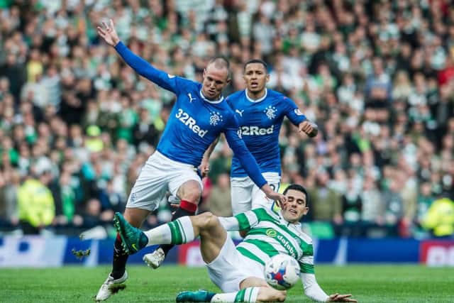 Kenny Miller and Tom Rogic tussle for the ball in an Old Firm clash at Hampden. Picture: John Devlin