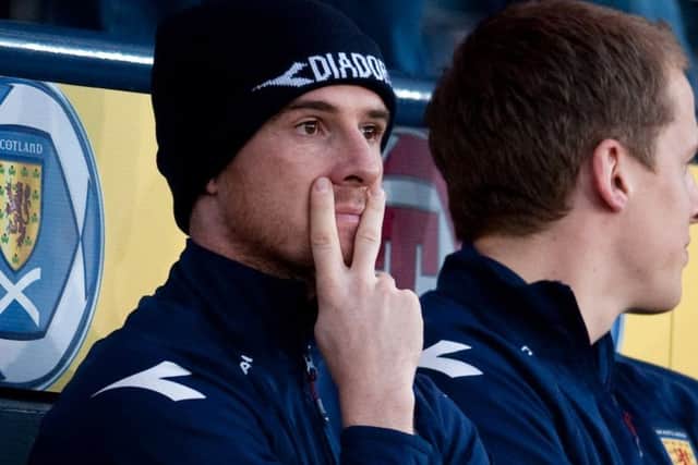 Barry Ferguson gestures with a V-sign while on the Scotland bench. Picture: SNS Group
