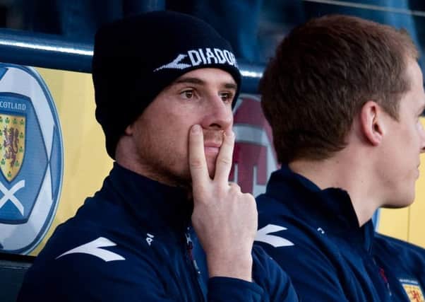 Barry Ferguson gestures with a V-sign while on the Scotland bench. Picture: SNS Group