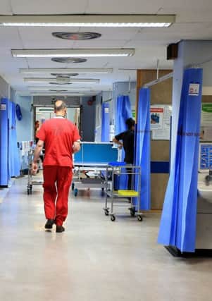 Health boards across Scotland are on track to fall further behind a key target for A&E waiting times.  Picture: Peter Byrne/PA