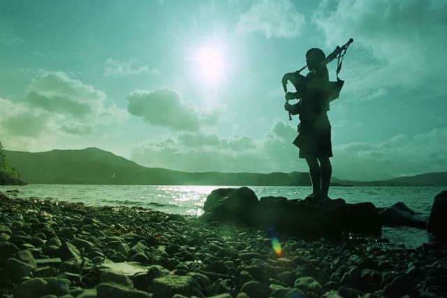 A piper celebrates the coming of The Royal National Mod to Portree, Skye, in 1998. PIC: TSPL.