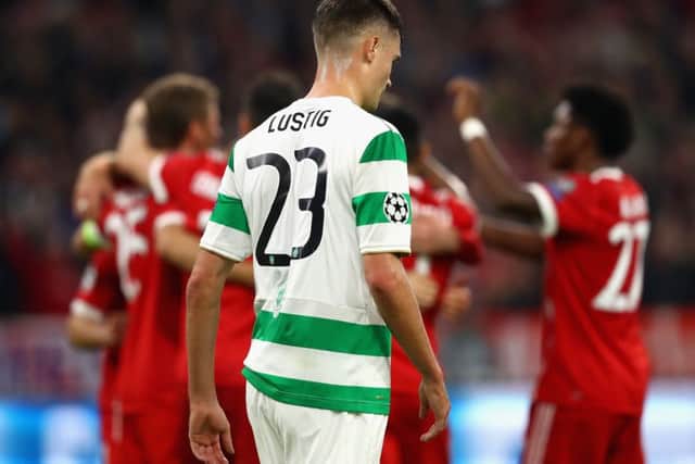A dispirited Mikael Lustig as Bayern Munich celebrate the opening goal. Picture: Getty