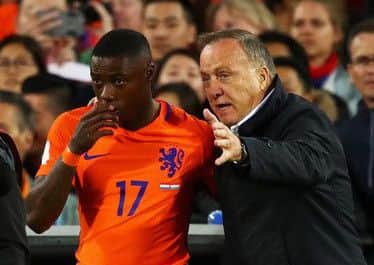 Advocaat gives instructions to Quincy Promes as the player prepares to come on as a substitute against Luxembourg. Picture: Getty Images
