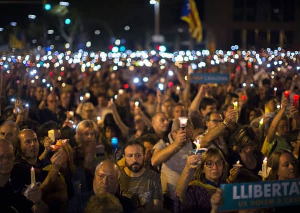 Catalonia: People stay on one of the city's main avenues to protest against the National Court's decision to imprison civil society leaders without bail. Picture; AP