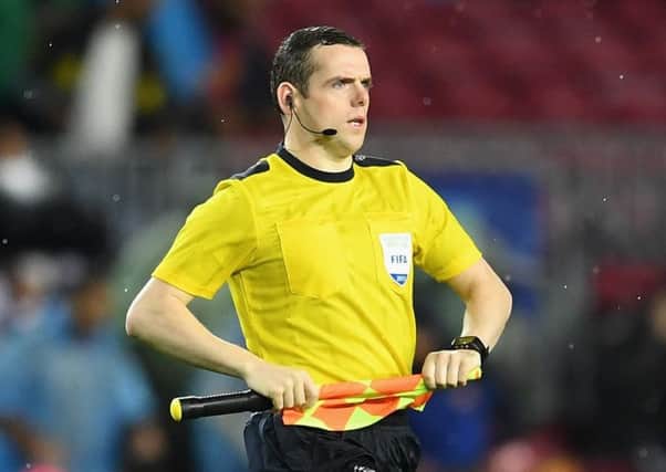 Conservative MP Douglas Ross says he will quit his second job as a referee, but only after next years World Cup.