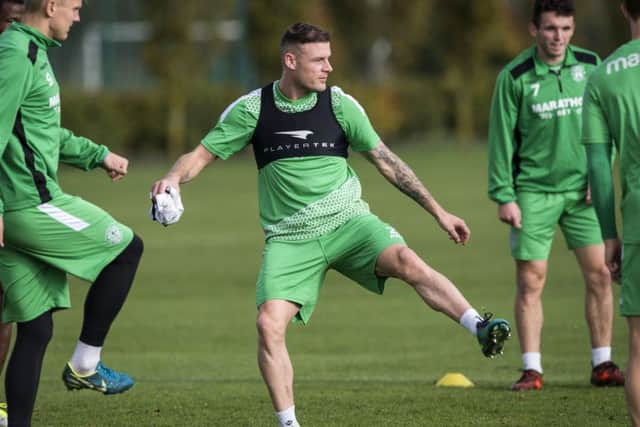Anthony Stokes, centre, will be a key man for Hibs as they attempt to end Celtics record run. Picture: SNS.