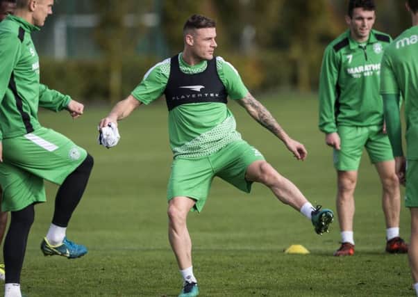 Anthony Stokes, centre, will be a key man for Hibs as they attempt to end Celtics record run. Picture: SNS.