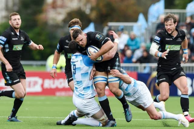 Warriors' Adam Ashe is tackled by Leinster's James Ryn and Johnny Sexton. Picture: SNS