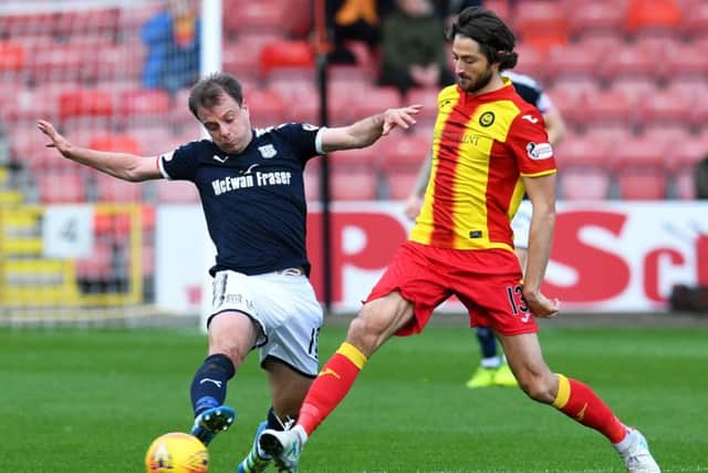 Dundee's Paul McGowan (left) and Adam Barton in action. Picture: SNS/Craig Foy