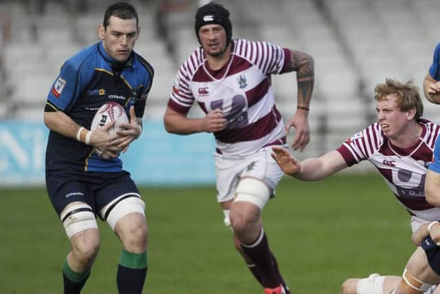 Euan Dods of Watsonians in action with Tom Brennan and Jonny Adams of Boroughmuir. Picture: Neil Hanna