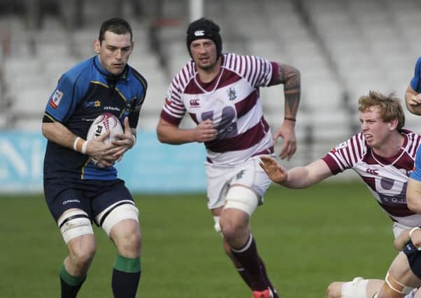 Euan Dods of Watsonians in action with Tom Brennan and Jonny Adams of Boroughmuir. Picture: Neil Hanna