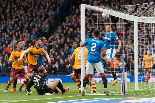 With Ben Alwnick grounded, Louis Moult is the quickest to react in the box to fire Motherwell ahead from close range.