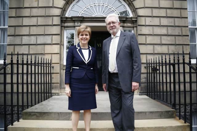 Nicola Sturgeon and Brexit minister Mike Russell pose for a picture at the entrance to Bute House, which has been home to First Ministers since 1999