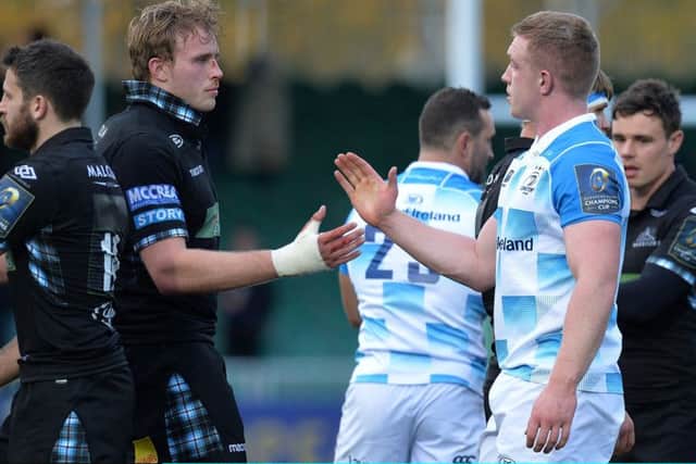 GLASGOW, SCOTLAND - OCTOBER 21: Jonny Grey of Glasgow Warriors shakes hands with Dan Leavy of Leinster Rugby at the final whistle during the European Rugby Champions Cup match between Glasgow Warriors and Leinster Rugby at Scotstoun Stadium on October 21, 2017 in Glasgow, Scotland. (Photo by Mark Runnacles/Getty Images)