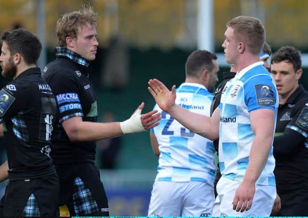 GLASGOW, SCOTLAND - OCTOBER 21: Jonny Grey of Glasgow Warriors shakes hands with Dan Leavy of Leinster Rugby at the final whistle during the European Rugby Champions Cup match between Glasgow Warriors and Leinster Rugby at Scotstoun Stadium on October 21, 2017 in Glasgow, Scotland. (Photo by Mark Runnacles/Getty Images)