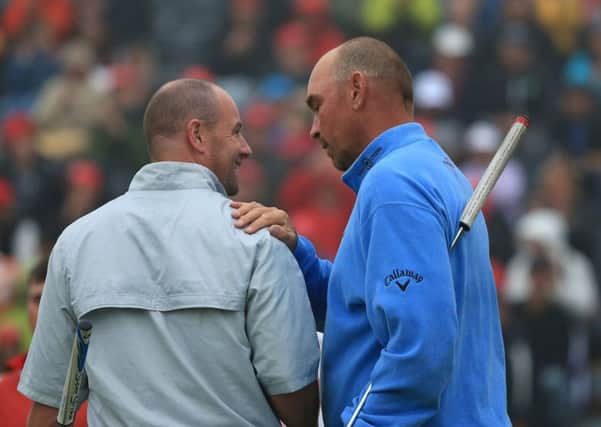 Scotland's Craig Lee, left, is consoled by Thomas Bjorn after the Dane beat him in a play-off at the 2013 Omega European Masters. Picture: Richard Heathcote/Getty Images
