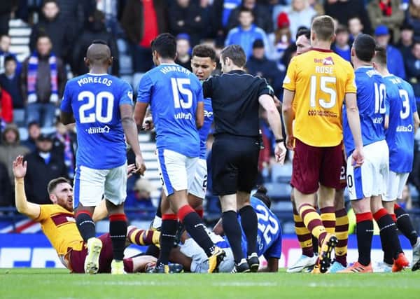 The aftermath of the clash between Bruno ALves and Louis Moult. Picture: Rob Casey/SNS