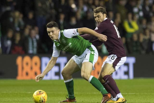 Hibernian's John McGinn (left) competes with Hearts' Rafal Grzelak. Picture: SNS