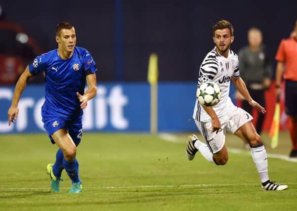 Filip Benkovic, left, vies with Juventus midfielder Miralem Pjanic during a Champions League match in September 2016. Picture: AFP/Getty Images