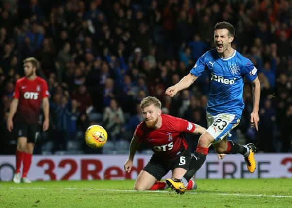 Jason Holt celebrates opening the scoring for Rangers. Picture: PA