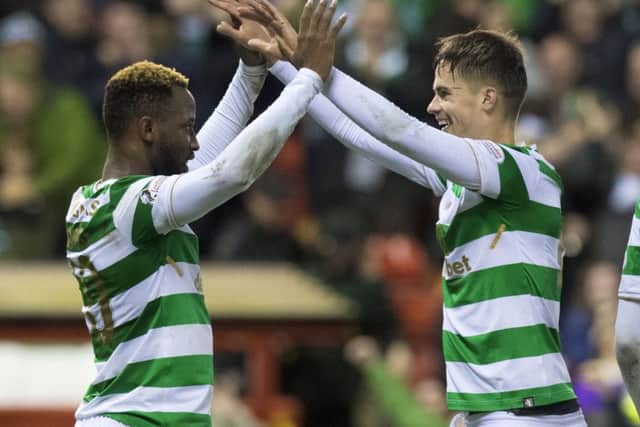 Celtic's Moussa Dembele, left, celebrates his second goal with team-mate Mikael Lustig