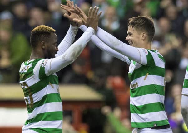 Celtic's Moussa Dembele, left, celebrates his second goal with team-mate Mikael Lustig