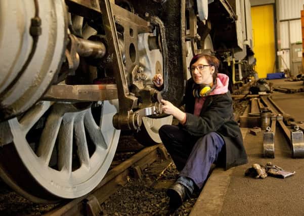 Jayne Wright at work on a steam engine at Boness. Picture: Alistair Linford