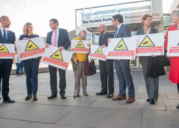 Kay, Dowager Duchess of Hamilton, with animal rights campaigners and MSPs outside the Scottish Parliament.
PICTURE: IAN GEORGESON